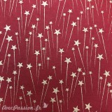 Papier fantaisie supernova rouge étoiles dorées