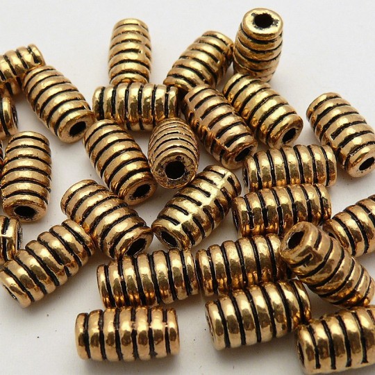 Perle métal cylindre ciselé vieil or 17x7mm Perle métal cylindre ciselé vieil or 17x7mm