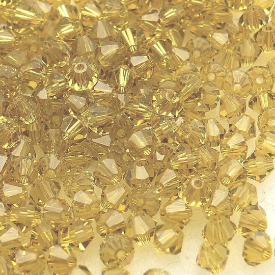 Perles Swarovski Toupies jaune lime 4mm qu50 Perles Swarovski Toupies jaune lime 4mm qu50